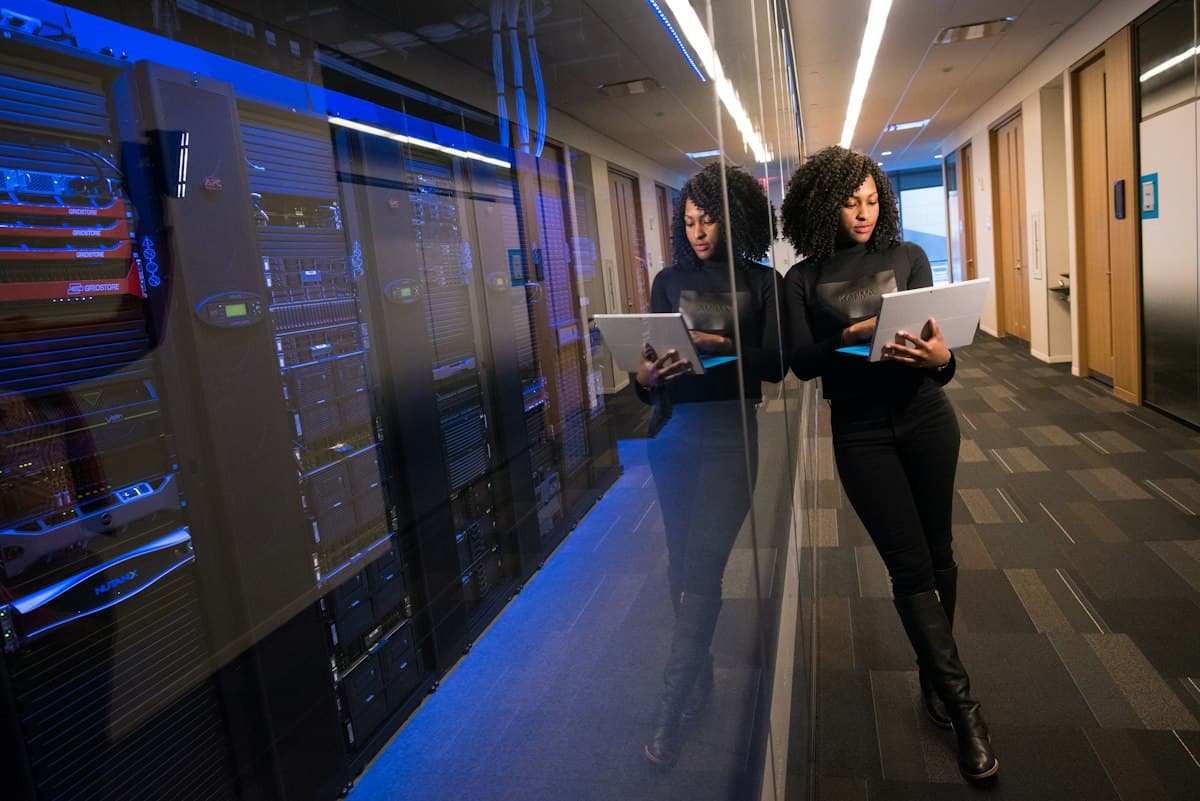 A professional working on technology solutions in a modern office