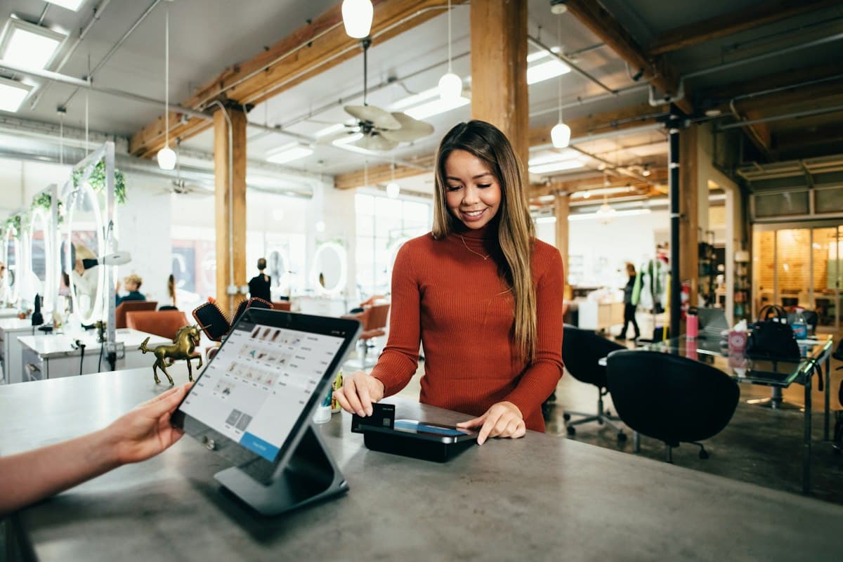 A small business owner using a point-of-sale system